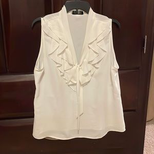 Off white sleeveless blouse